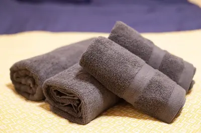a towel that is sitting on top of a bed at Lucky Higashimizue \u30e9\u30c3\u30ad\u30fc\u6771\u745e\u6c5f in Tokyo