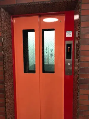 an orange door with two windows on a building at suny 504-SJ0009 in Tokyo