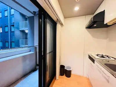 a kitchen with a large window and a stove at JUN Kabukicho-SJ0096 in Tokyo