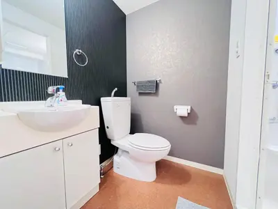 a bathroom with a white toilet and a sink at JUN Kabukicho-SJ0096 in Tokyo