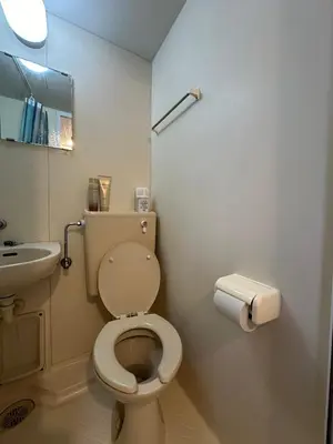 a small bathroom with a toilet and a sink at Garden square in Tokyo