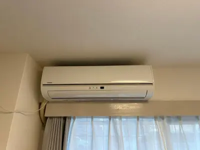 a dvd player sitting on top of a ceiling at Garden square in Tokyo