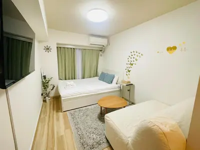 a small room with two beds and a window at Y-shinjuku kabukicho-SJ0018 in Tokyo