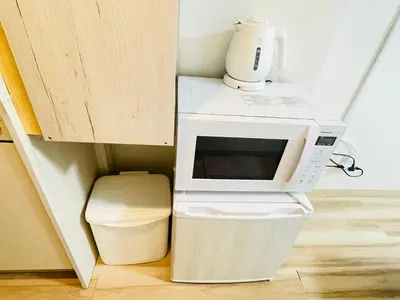 a microwave oven sitting on top of a toilet at Y-shinjuku kabukicho-SJ0018 in Tokyo