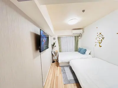 a small room with two beds and a tv at Y-shinjuku kabukicho-SJ0018 in Tokyo