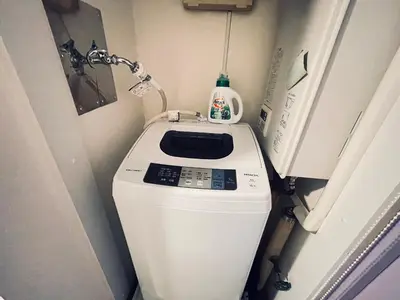 a washer and dryer in a small bathroom at Y-shinjuku kabukicho-SJ0018 in Tokyo
