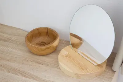 a mirror and two wooden bowls on a wooden floor at FINOA Residential Suite Kameari in Tokyo