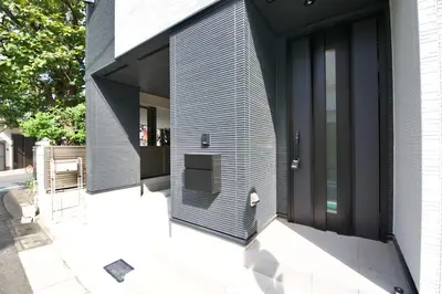 a house with a black and white facade at FINOA Residential Suite Kameari in Tokyo