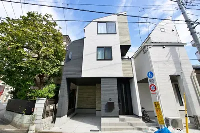 a house on the corner of a street at FINOA Residential Suite Kameari in Tokyo