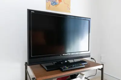 a large flat screen tv sitting on a table at F501 Shinkoiwa Sta 5min Free Wi-Fi Max 5 people in Tokyo