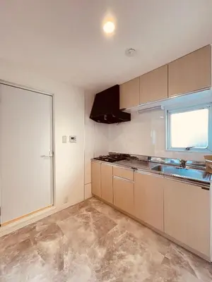 an empty kitchen with a sink and a window at home Shinjuku west302 in Tokyo