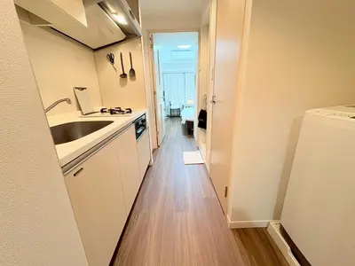 a small kitchen with a sink and a counter at SQ) SHIBUYA HOUSE in Tokyo