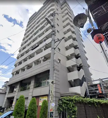 a tall white building with balconies on the side of it at SQ) SHIBUYA HOUSE in Tokyo