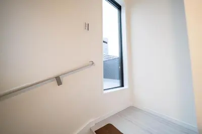 a staircase in a house with a window at Maison Novel under Skytree in Tokyo