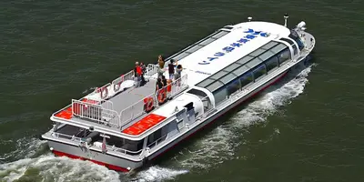 a ferry boat in the water with people on it at Cube Stay \u5317\u6771\u4eac in Tokyo