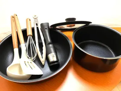 a black bowl filled with utensils on a table at Cube Stay \u5317\u6771\u4eac in Tokyo