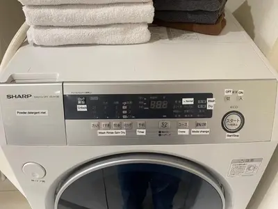 a washing machine with towels on top of it at Building A - Vacation STAY 15789 in Tokyo