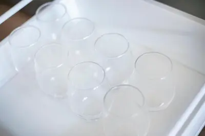 a bunch of wine glasses sitting on a table at Pufuka Shin nakadori in Tokyo