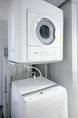 a washer and dryer in a hospital room at Pufuka Shin nakadori in Tokyo