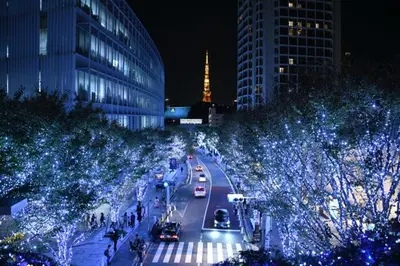 a city street at night with traffic and christmas lights at Rento Park Shiba 401 in Tokyo