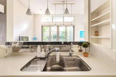 a kitchen with a sink and a window at Okusawa Private House in Tokyo