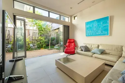 a living room with a couch and a table at Okusawa Private House in Tokyo