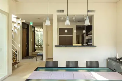 a kitchen and dining room with a table and chairs at Okusawa Private House in Tokyo