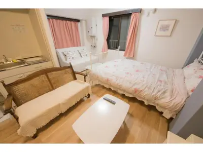 a small room with a bed and a table at Mini Hotel Shinjuku Front - Vacation STAY 89788v in Tokyo