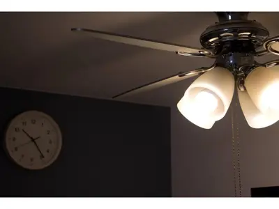 a ceiling fan and a clock on a wall at Mini Hotel Shinjuku Front - Vacation STAY 89788v in Tokyo