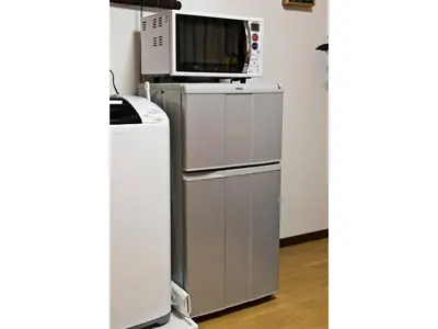 a microwave oven sitting on top of a refrigerator at Mini Hotel Shinjuku Front - Vacation STAY 89774v in Tokyo