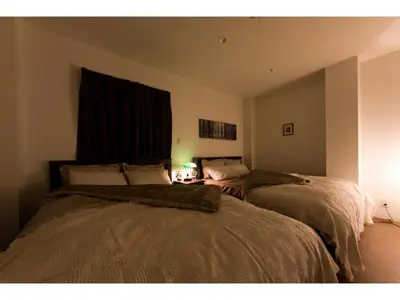 a bedroom with two beds and a window at Mini Hotel Shinjuku Front - Vacation STAY 89794v in Tokyo