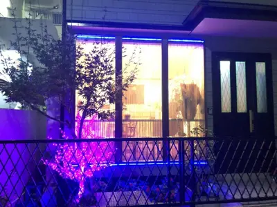 a house with purple and blue lights on the window at \u51a0\u4eac\u30db\u30c6\u30eb in Tokyo