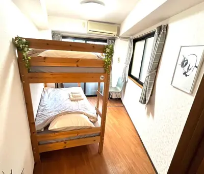 a bunk bed in a tiny house at HARUKAZE HOUSE in Tokyo
