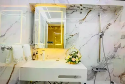 a bathroom with a white sink and a mirror at Reimi Mondo701 in Tokyo