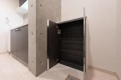 a walk in closet with a black door at Ferio\u84b2\u7530 in Tokyo
