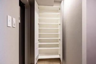 a walk in closet with stairs in a room at Alterna\u8535\u524d in Tokyo