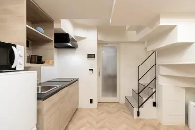 a kitchen with a sink and a stairway at belle ville \u795e\u697d\u5742 in Tokyo