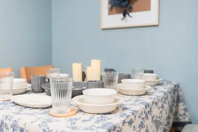 a table with plates and glasses on top of it at HARMONIA\u6771\u4eac\u5800\u5207403 in Tokyo