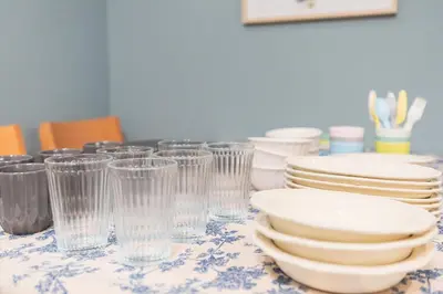a table with plates and cups on a table at HARMONIA\u6771\u4eac\u5800\u5207403 in Tokyo