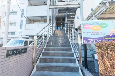 a set of stairs leading up to a building at HARMONIA\u6771\u4eac\u5800\u5207403 in Tokyo