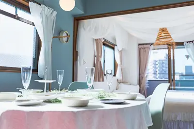 a table with white plates and glasses on it at HARMONIA\u6771\u4eac\u5800\u5207502 in Tokyo