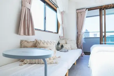 a room with a couch and a table at HARMONIA\u6771\u4eac\u5800\u5207502 in Tokyo