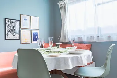 a dining room table with a white table cloth at HARMONIA\u6771\u4eac\u5800\u5207502 in Tokyo