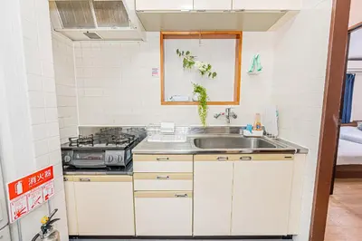 a kitchen with a sink and a stove at Bright Modern Airbnb in Tokyo's Northern District in Tokyo