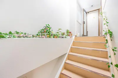 a staircase with potted plants on it at Bright Modern Airbnb in Tokyo's Northern District in Tokyo