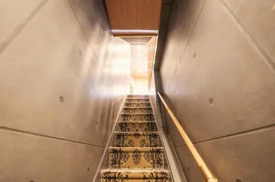 an empty stairway in a building with a stair case at Itabashi Ekimae - Diamond Yu in Tokyo