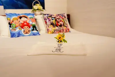 a hotel room with a towel on a bed at Itabashi Ekimae - Diamond Yu in Tokyo