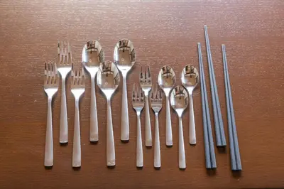 a group of forks and spoons on a table at GuestHouse　YOU&I平和島 in Tokyo