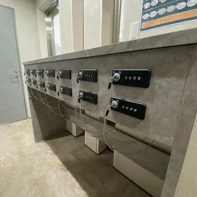 a row of controls on a wall in a room at BbyC APARTMENT 浅草花園通 レンタカー&サウナ付ホテル in Tokyo