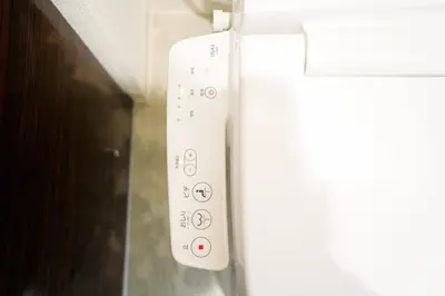 a white remote control on the side of a refrigerator at The Baron\u897f\u65b0\u5bbf303\u30bb\u30eb\u30d5\u30b3\u30fc\u30d2\u30fc\u4ed8\u304d in Tokyo